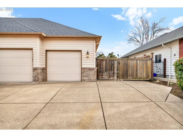 a view of a house with a parking area