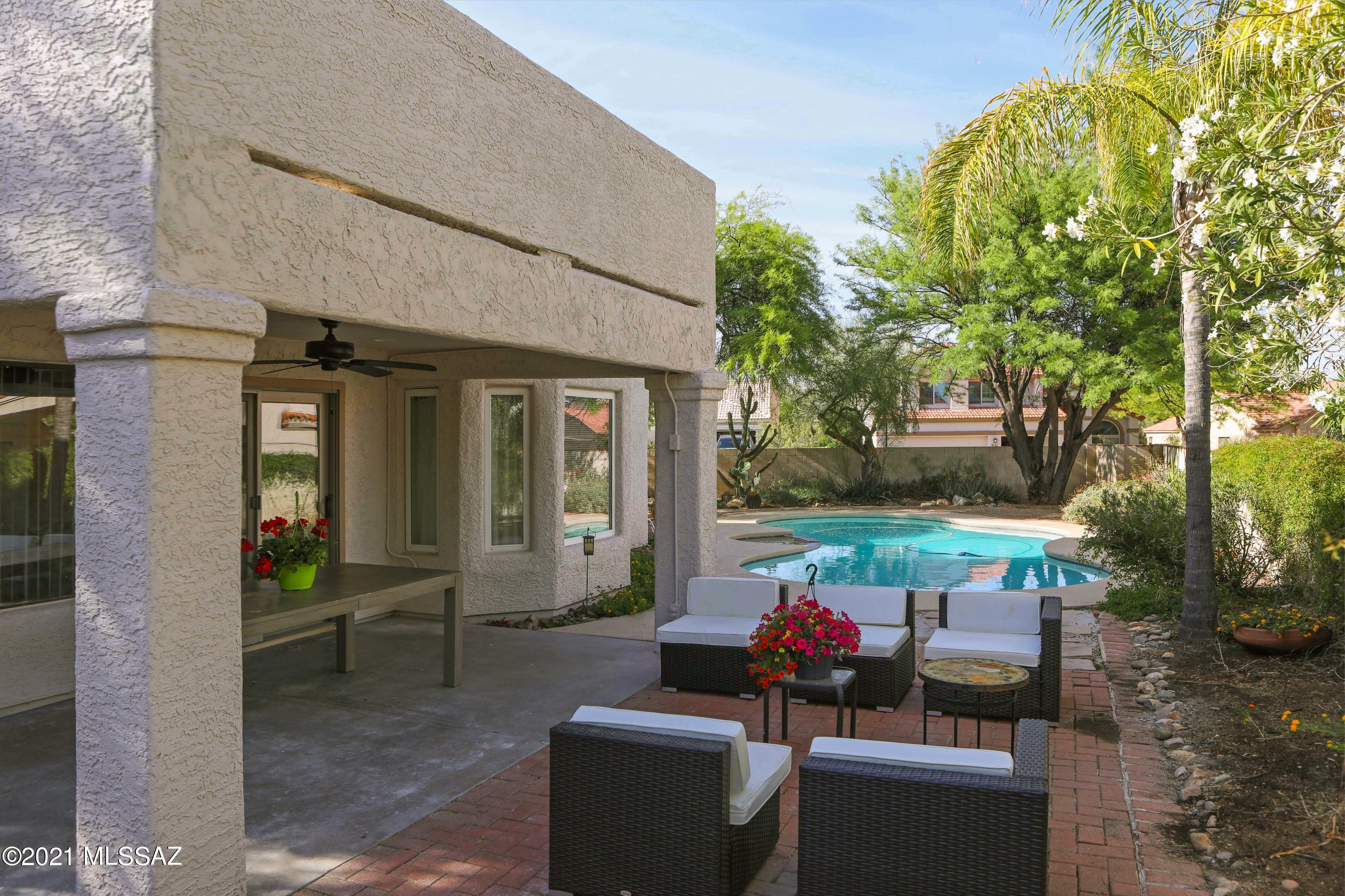 12560 North Wayfarer Way Oro Valley, AZ 85755 - Photo 18 of 43 a view of a patio with couches chairs and a potted plant