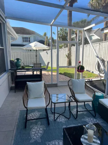 a outdoor living space with furniture and a table