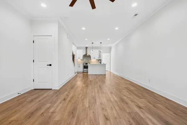 a view of a kitchen with wooden floor