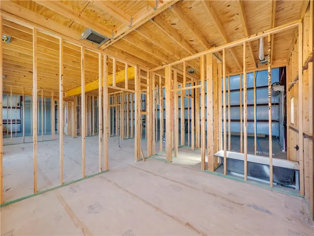a view of an empty room with gym equipment