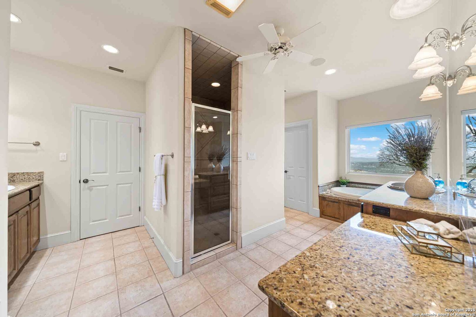211 Mill Dam Road Comfort, TX 78013 - Photo 24 of 61 a living room with a couch and a dining table with wooden floor