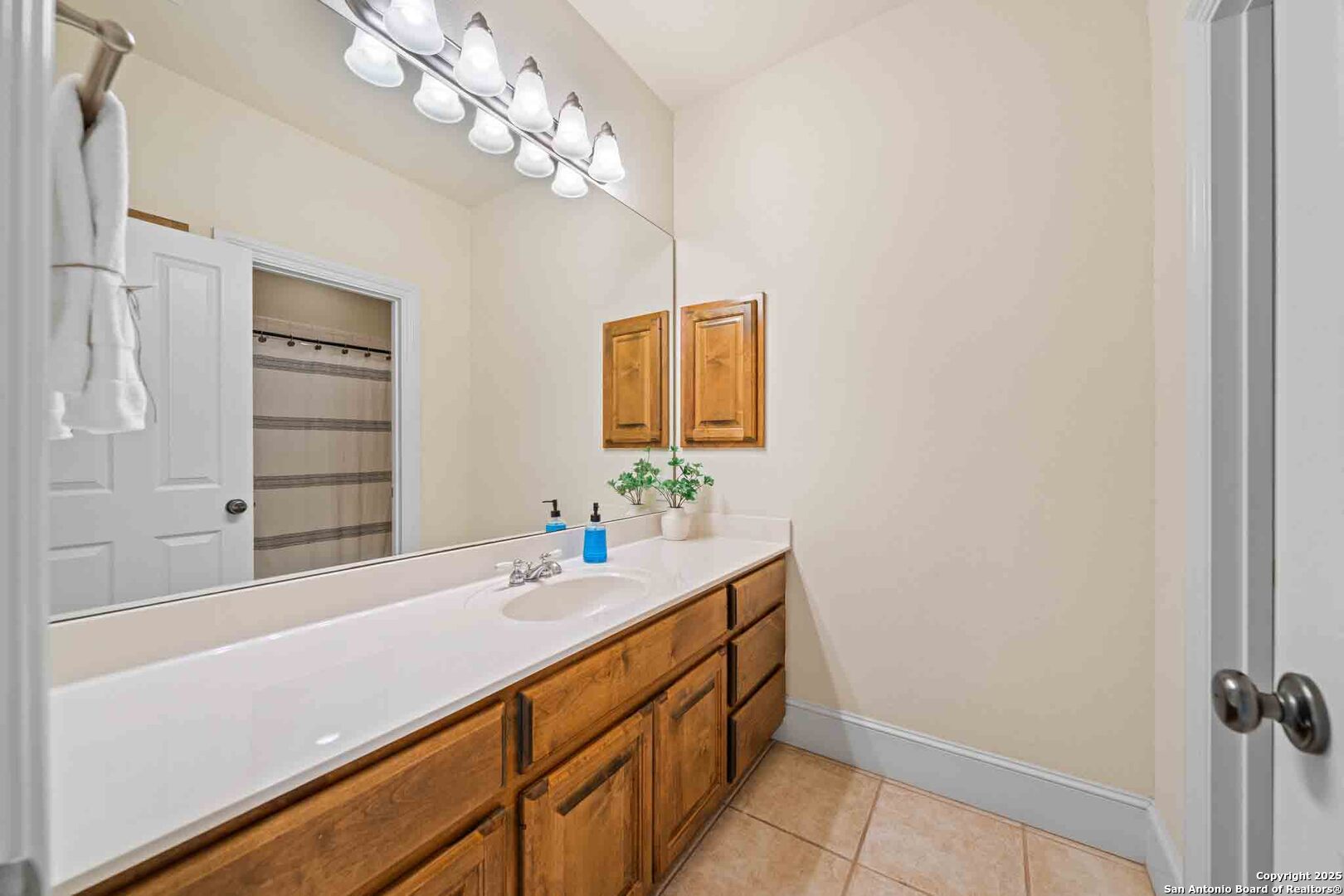 211 Mill Dam Road Comfort, TX 78013 - Photo 29 of 61 a bathroom with a sink and a mirror