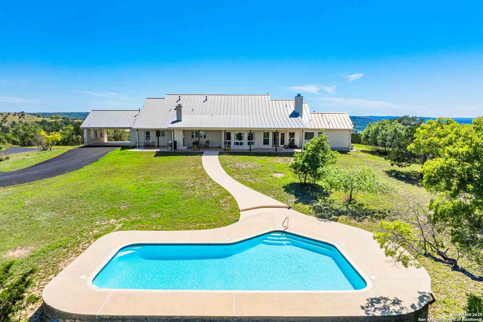 211 Mill Dam Road Comfort, TX 78013 - Photo 3 of 61 a view of a swimming pool with an outdoor seating
