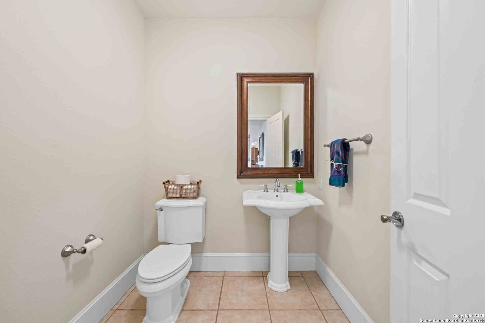 211 Mill Dam Road Comfort, TX 78013 - Photo 33 of 61 a bathroom with a toilet sink and mirror