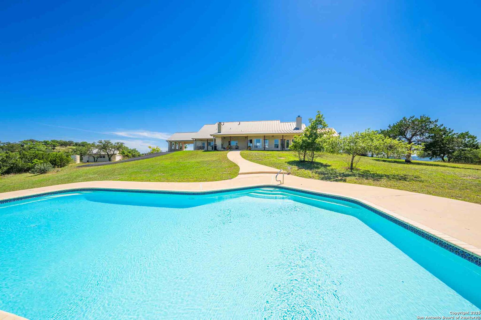 211 Mill Dam Road Comfort, TX 78013 - Photo 44 of 61 a view of a swimming pool and an outdoor seating