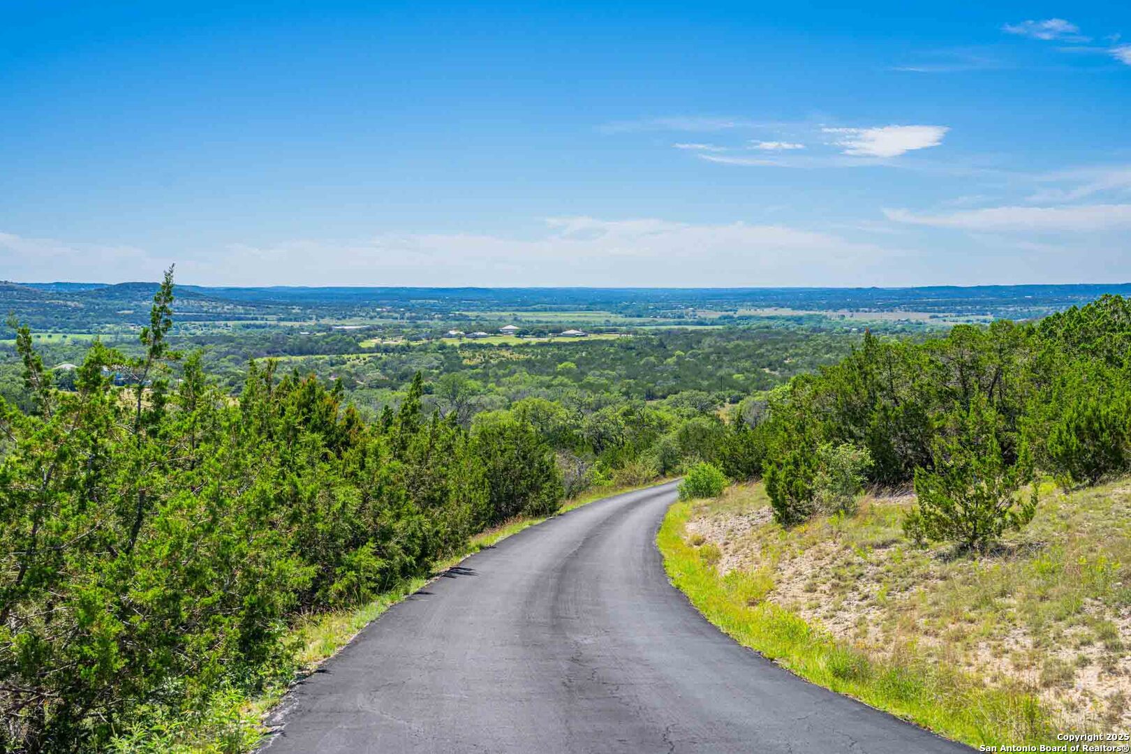 211 Mill Dam Road Comfort, TX 78013 - Photo 50 of 61 a view of a lake with a garden