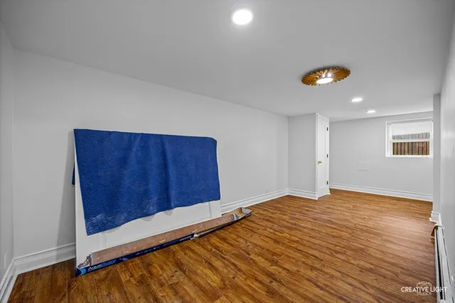 a spacious bedroom with a bed and a couch