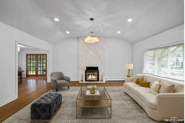 a living room with furniture and a fireplace