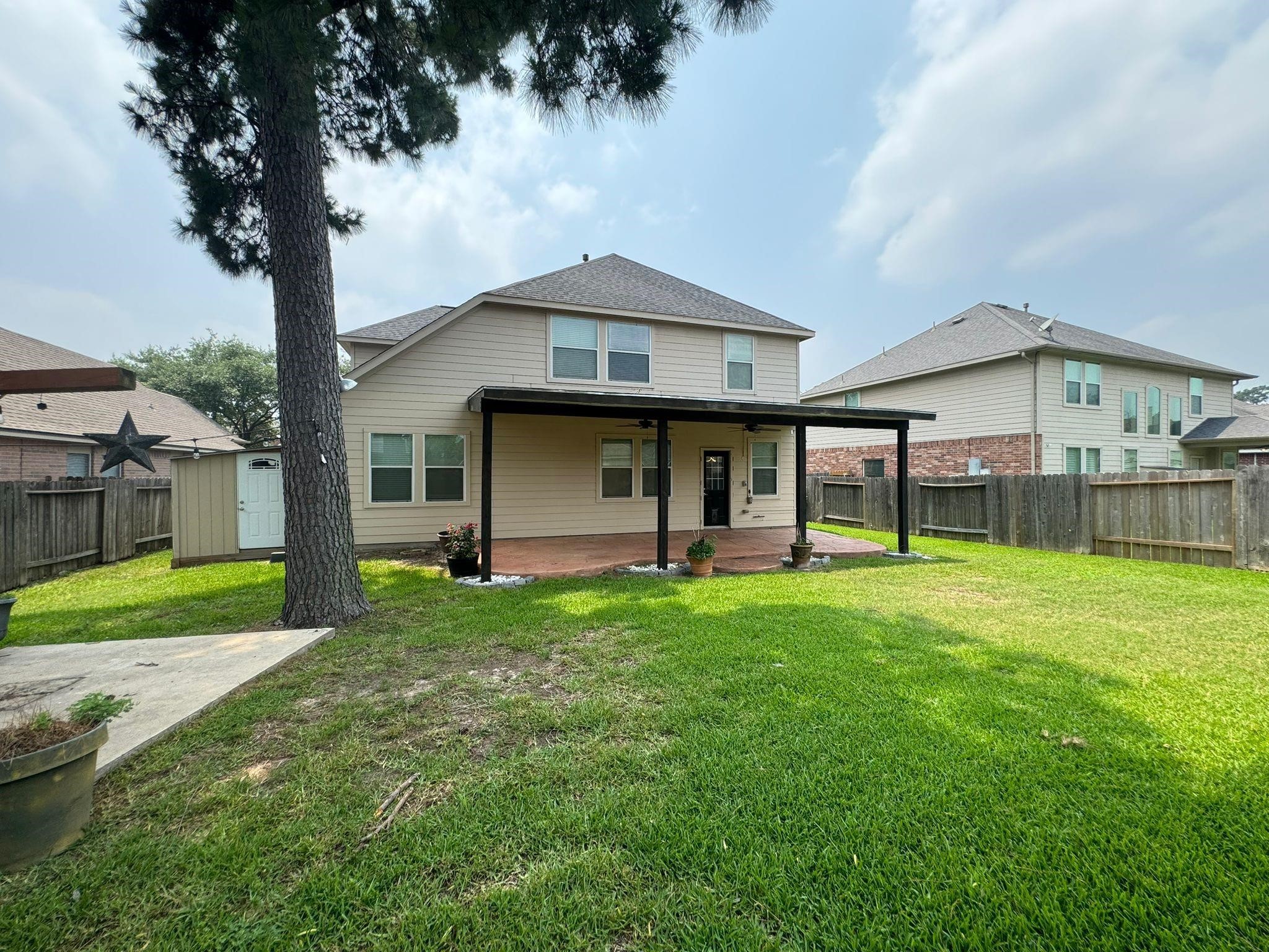 25614 Crisp Spring Lane Spring, TX 77373 - Photo 24 of 25 a front view of a house with a yard and porch