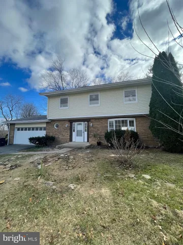a house view with a garden space