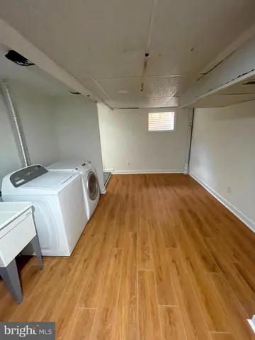a view of a storage & utility room with wooden floor