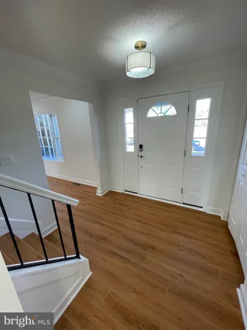 a view of staircase with white walls