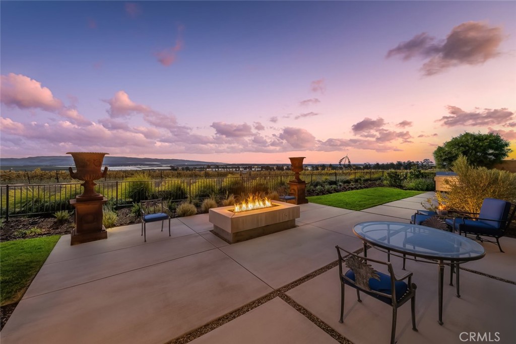 1650 Eucalyptus Road Nipomo, CA 93444 - Photo 22 of 60 a view of a patio with couches and table and chairs and potted plants