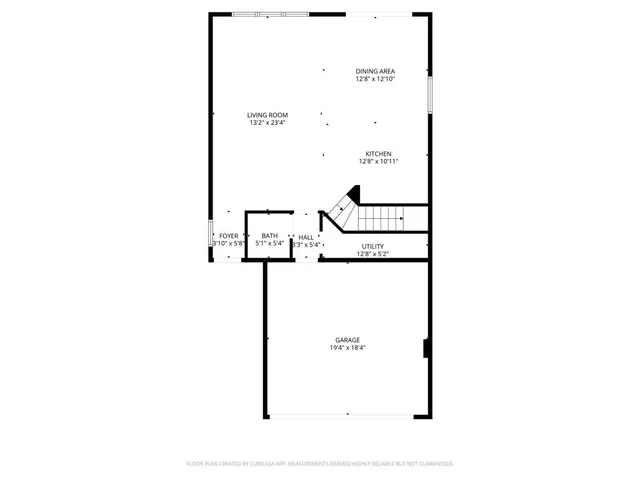 a picture of a bench in front of a wall