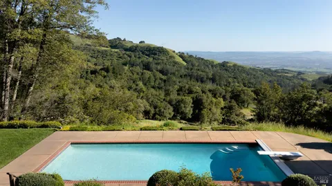 a view of swimming pool from a balcony