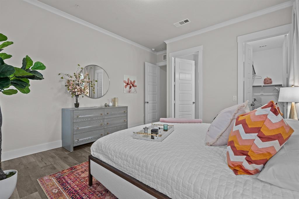 3275 Ganzer Road West, Unit 110A Denton, TX 76207 - Photo 20 of 25 a bedroom with a bed and closet