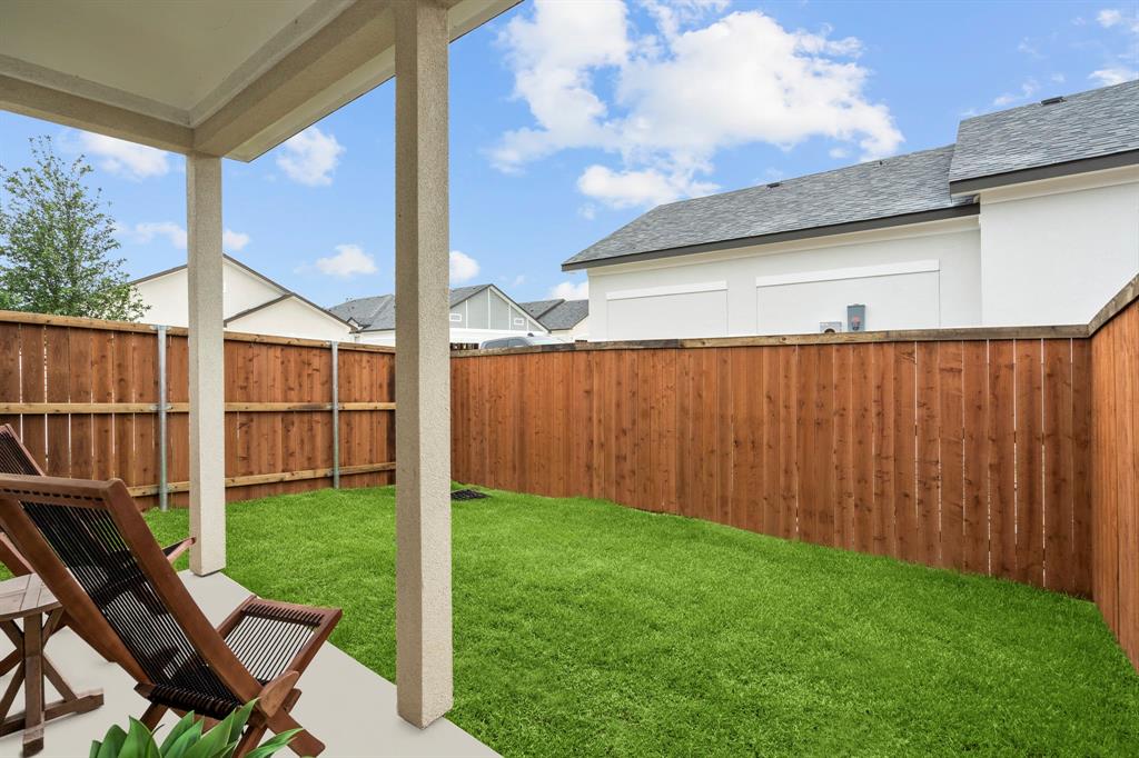 3275 Ganzer Road West, Unit 110A Denton, TX 76207 - Photo 23 of 25 a view of a backyard with a garden