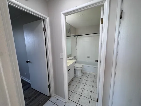 a bathroom with a shower and a toilet