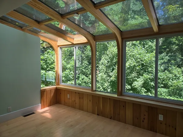 a view of backyard with green space and balcony