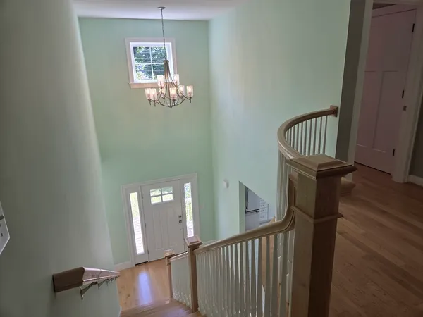 a view of entryway with wooden floor