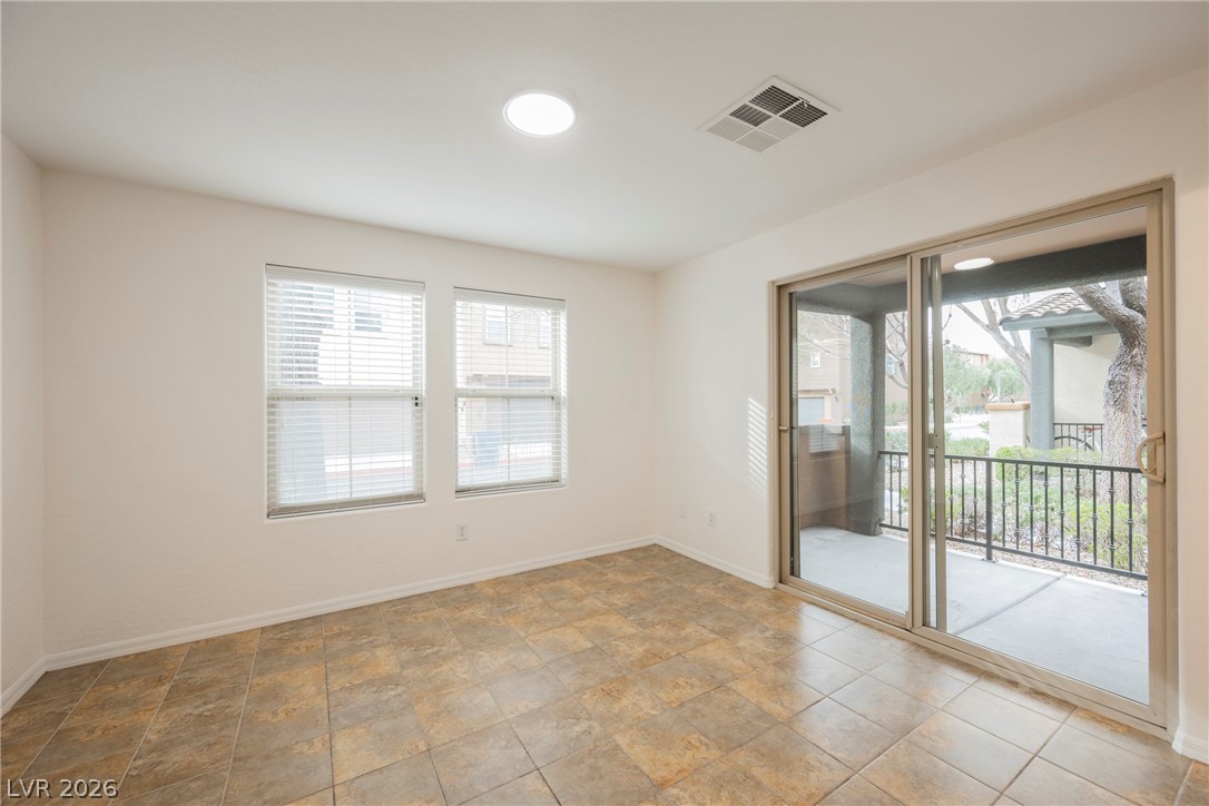 4650 Ranch House Road, Unit 64 North Las Vegas, NV 89031 - Photo 4 of 39 This airy room features durable tile flooring and access to a private patio through sliding glass doors.