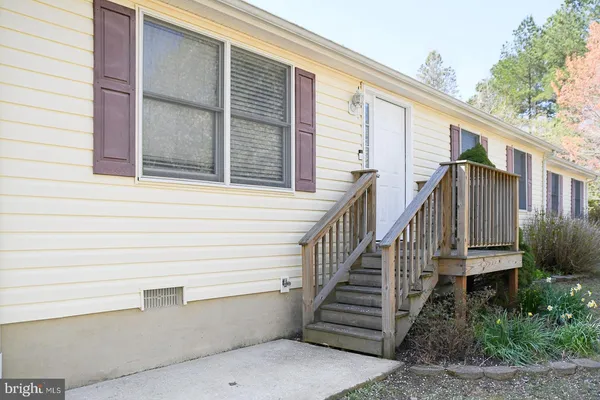 a view of a house with entryway and stairs
