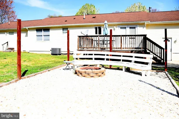 a view of a house with wooden floor and a yard