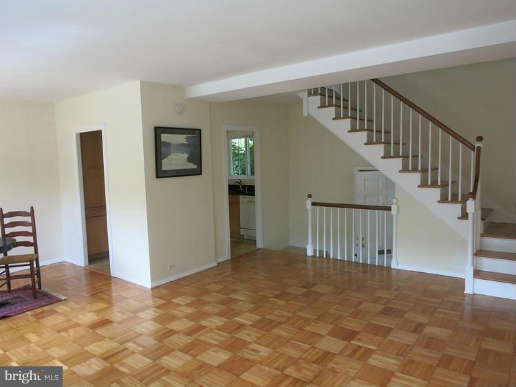 1619 Preston Road Alexandria, VA 22302 - Photo 3 of 13 a view of an empty room with stairs and a bedroom