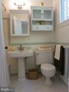 1619 Preston Road Alexandria, VA 22302 - Photo 8 of 13 a bathroom with a toilet sink and mirror