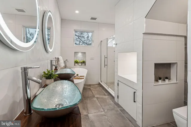 a living room with furniture and a mirror