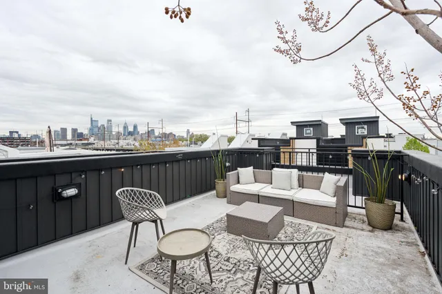 a view of a balcony with furniture