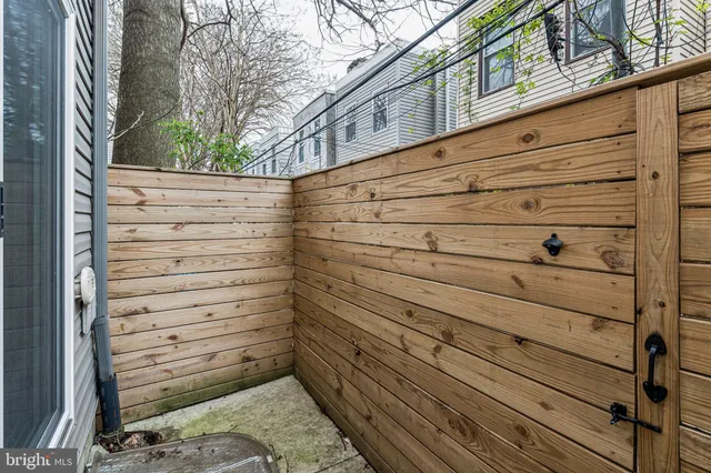 a view of a door and a wooden bench
