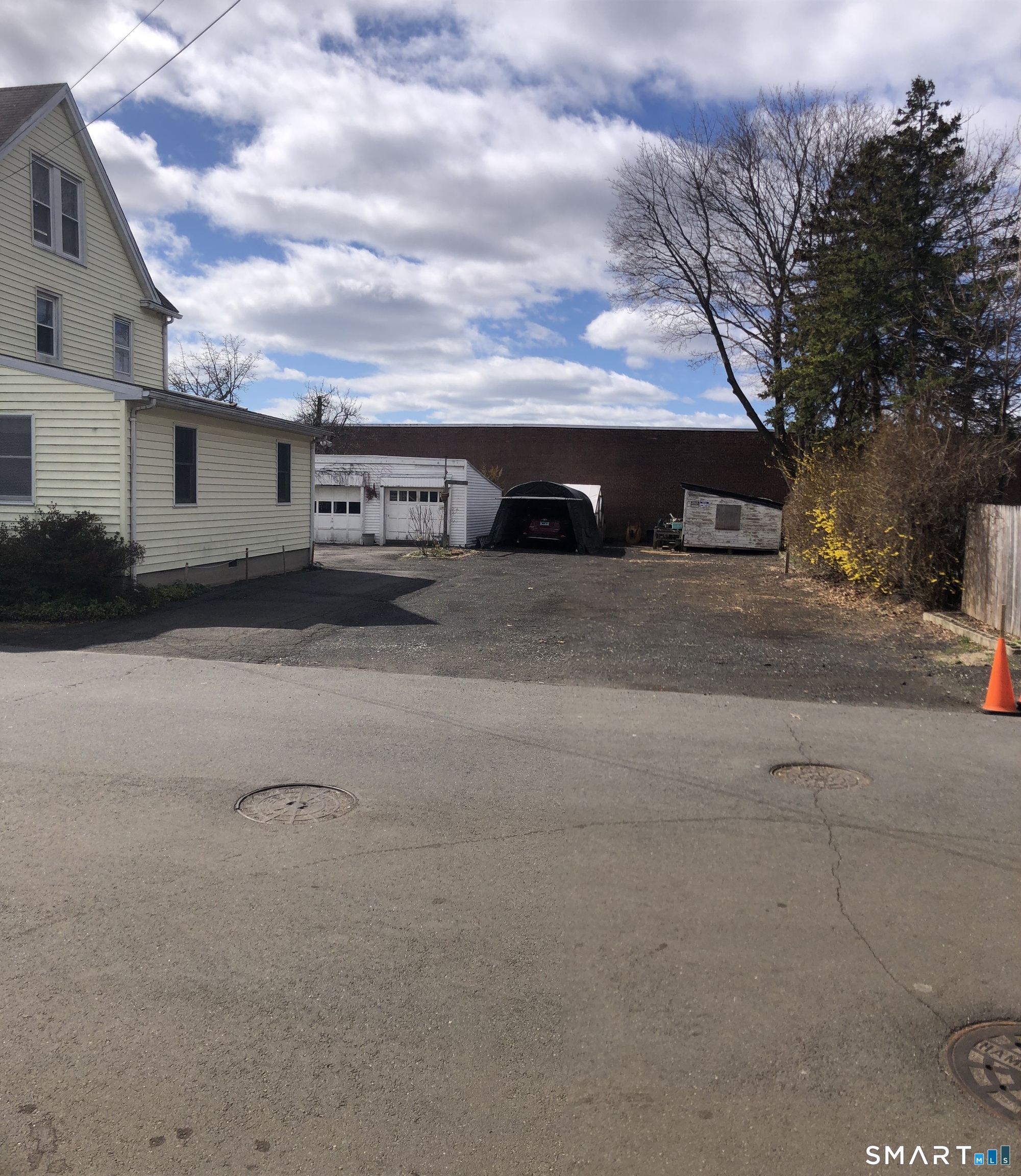 15 Oregon Avenue Hamden, CT 06514 - Photo 3 of 16 a view of a car parked in front of a house