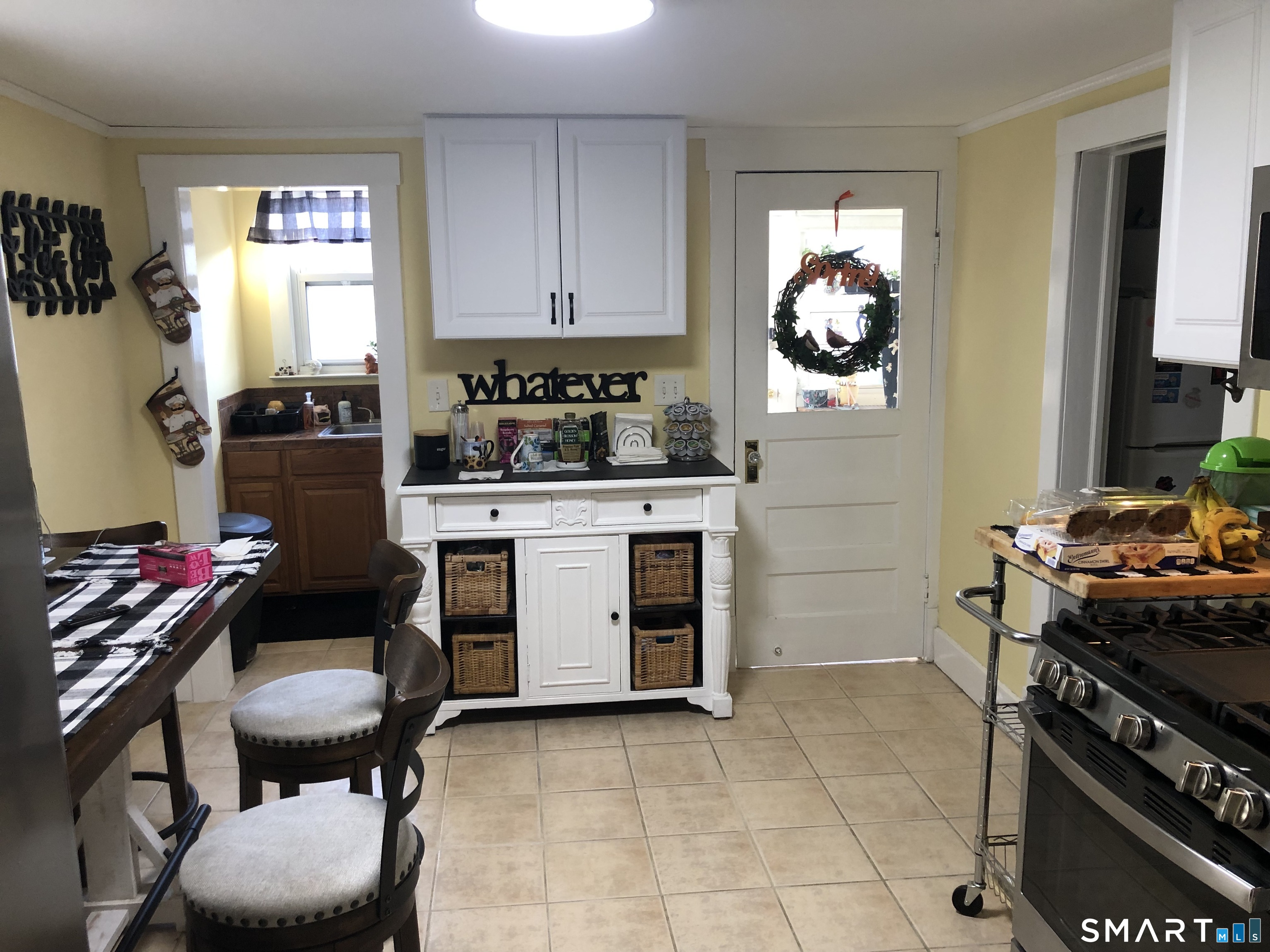 15 Oregon Avenue Hamden, CT 06514 - Photo 7 of 16 a kitchen with a stove and a refrigerator