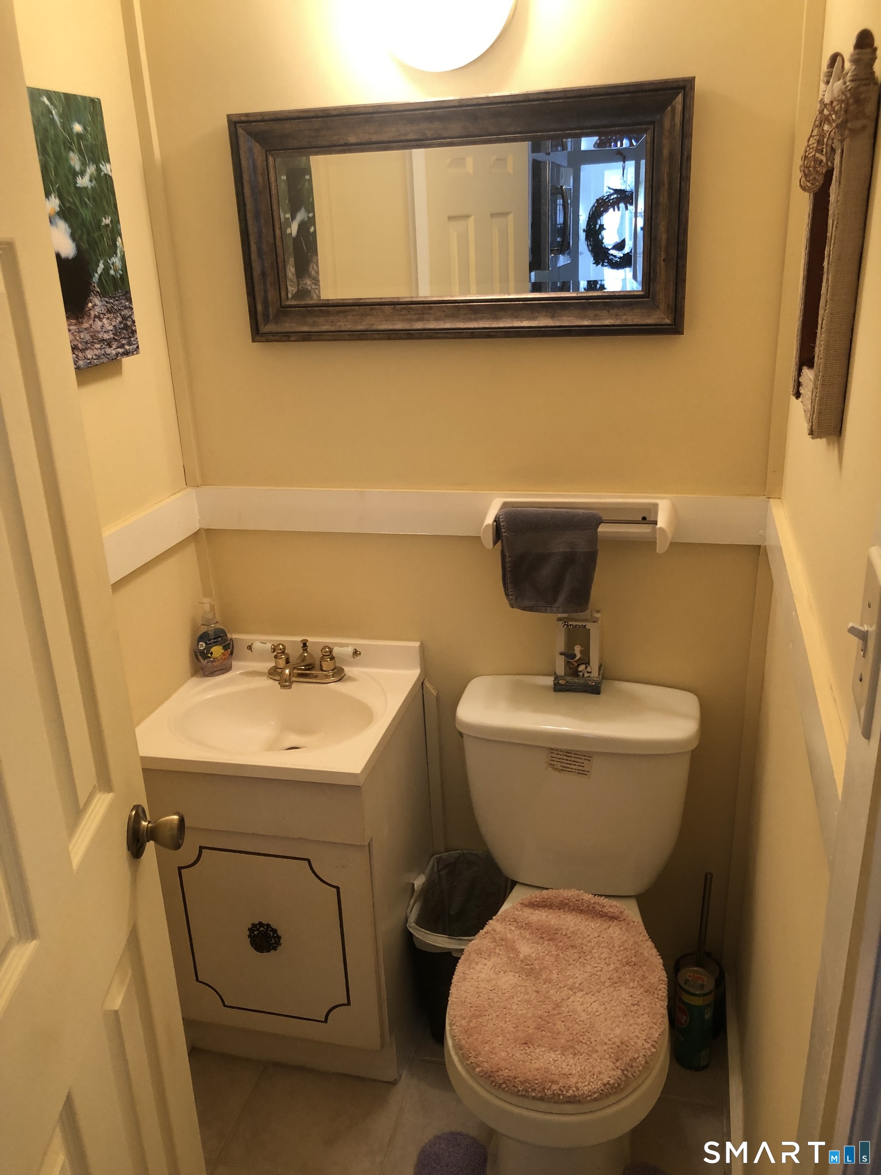 15 Oregon Avenue Hamden, CT 06514 - Photo 9 of 16 a bathroom with a toilet sink and mirror