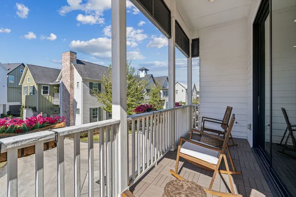 a view of balcony with furniture