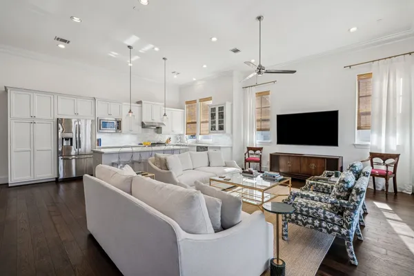 a living room with lots of furniture and a flat screen tv