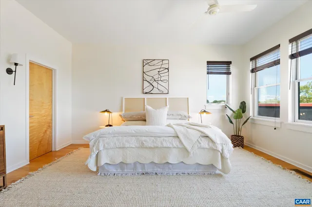 a bedroom with a bed and window