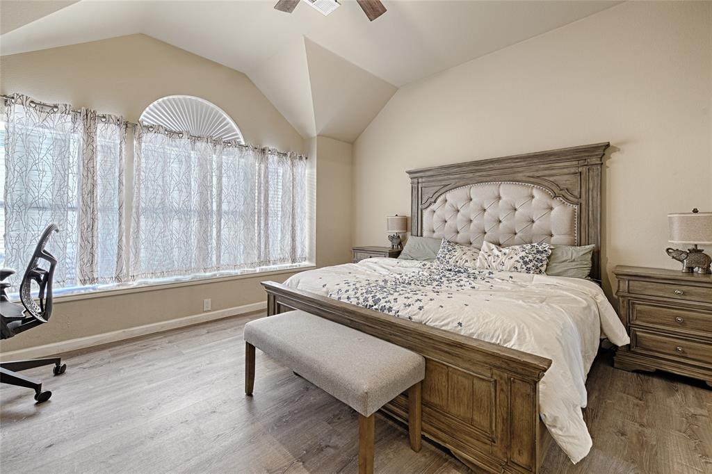 2704 Spring Drive McKinney, TX 75072 - Photo 13 of 35 a bedroom with a bed and a chair