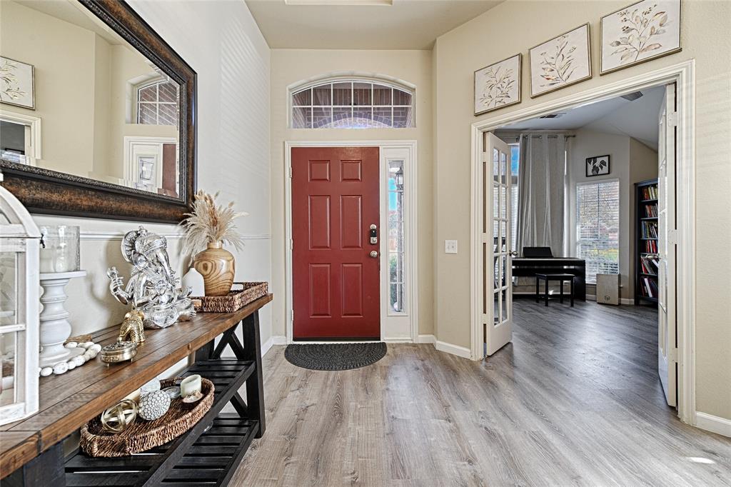 2704 Spring Drive McKinney, TX 75072 - Photo 18 of 35 a view of a livingroom with furniture and hardwood floor