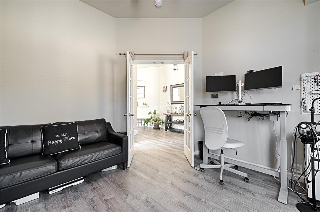 2704 Spring Drive McKinney, TX 75072 - Photo 19 of 35 a living room with furniture and a flat screen tv