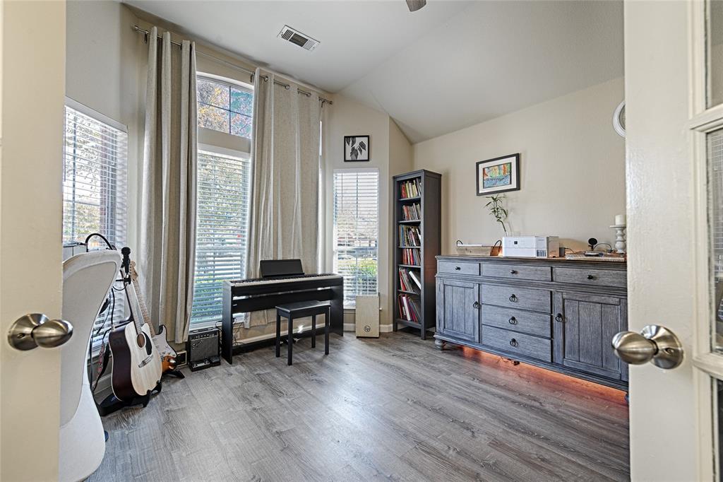 2704 Spring Drive McKinney, TX 75072 - Photo 2 of 35 a view of a workspace with furniture and a window