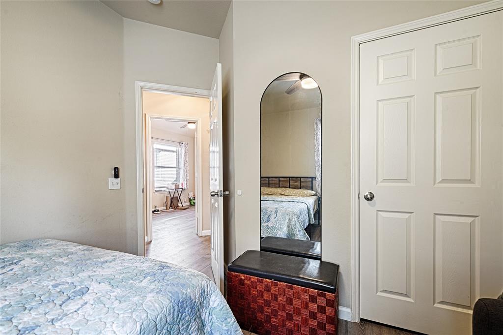 2704 Spring Drive McKinney, TX 75072 - Photo 21 of 35 a spacious bedroom with a bed and a dresser