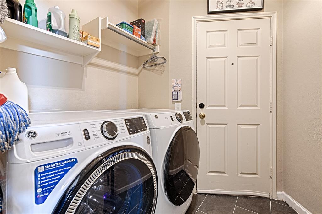 2704 Spring Drive McKinney, TX 75072 - Photo 26 of 35 a utility room with dryer and washer