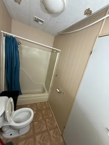 a bathroom with a sink and shower