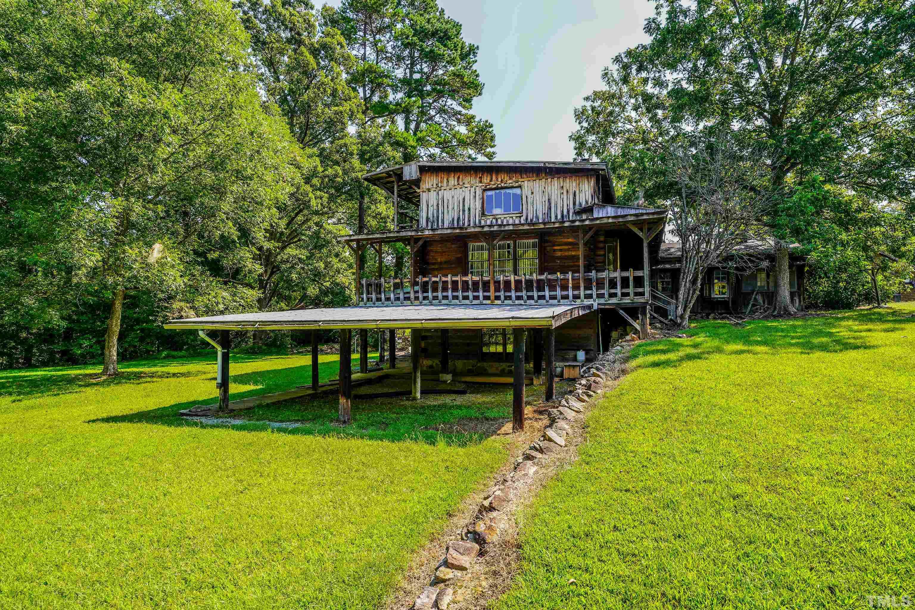 3640 Old Allensville Road Roxboro, NC 27574 - Photo 69 of 94 a view of a house with swimming pool and sitting area