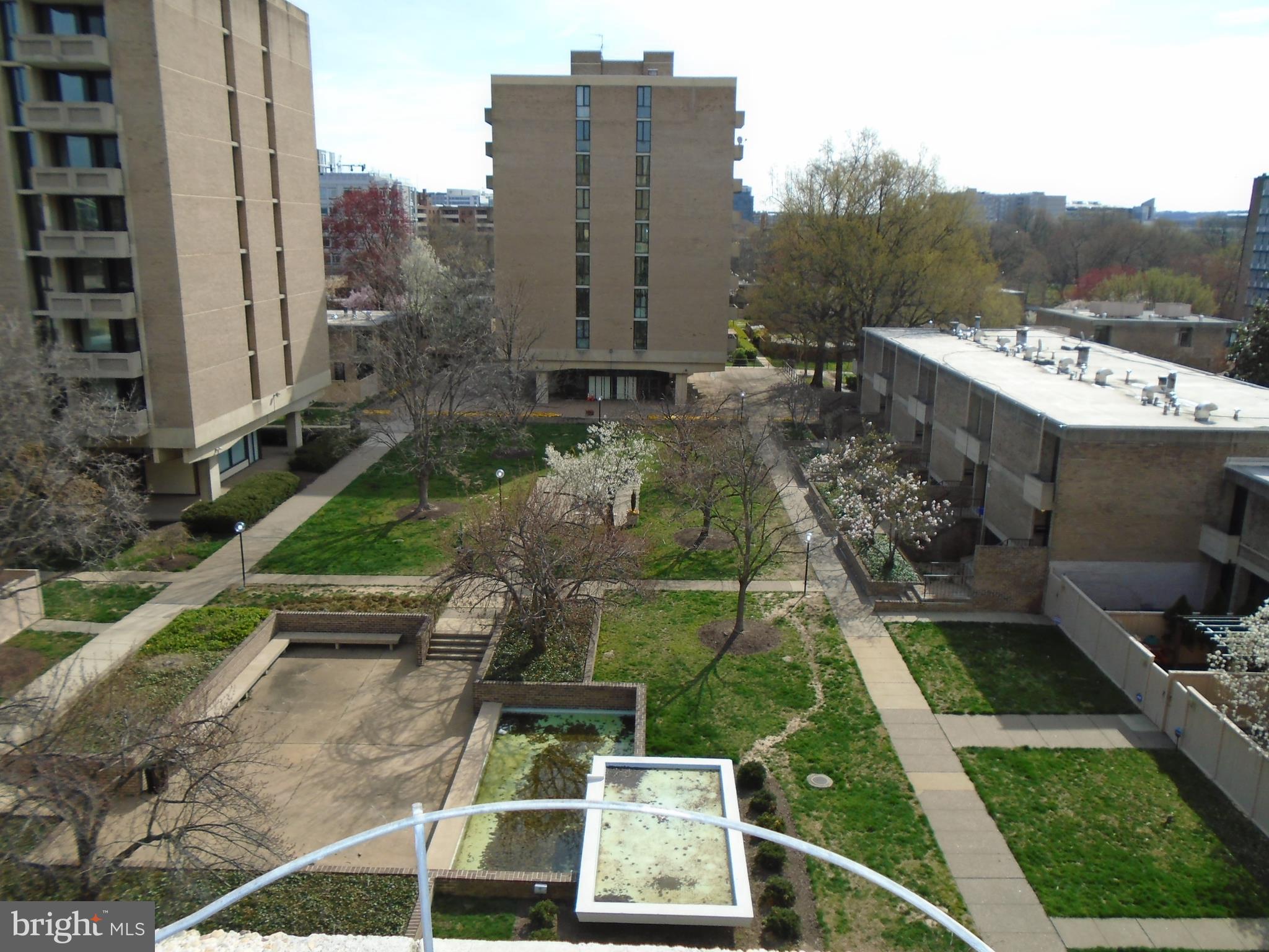 1250 4th Street Southwest, Unit W403 Washington, DC 20024 - Photo 26 of 41 a view of a patio with table and chairs and potted plants