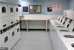 1250 4th Street Southwest, Unit W403 Washington, DC 20024 - Photo 29 of 41 a utility room with two washing machine