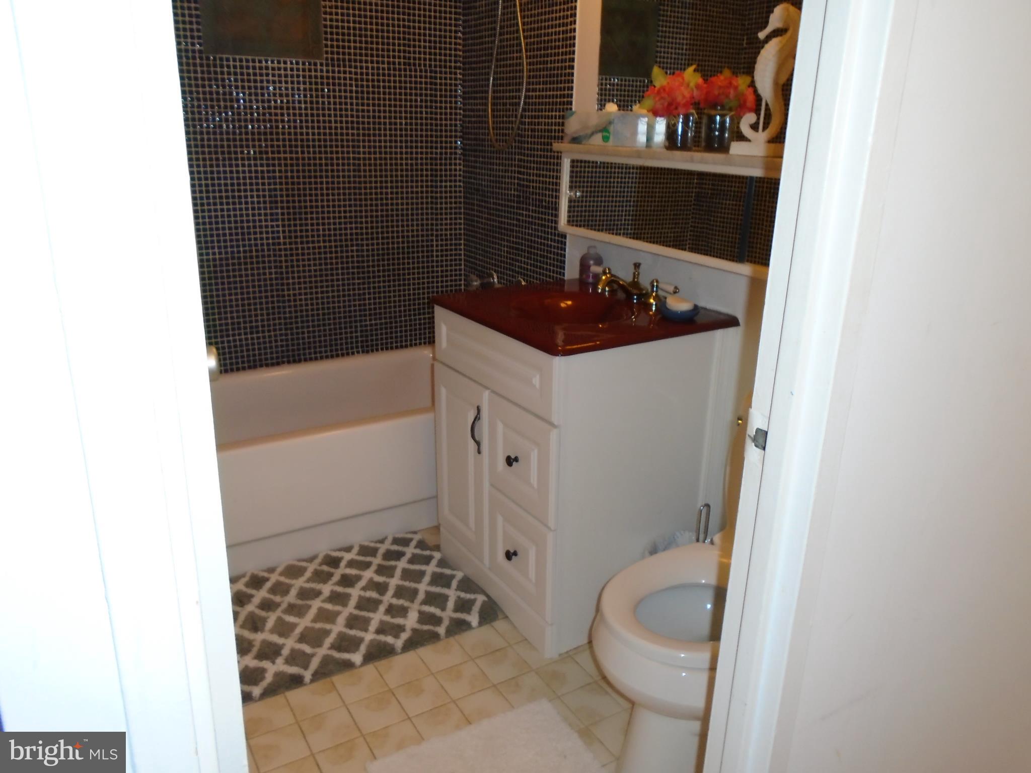 1250 4th Street Southwest, Unit W403 Washington, DC 20024 - Photo 9 of 41 a bathroom with a toilet and a shower